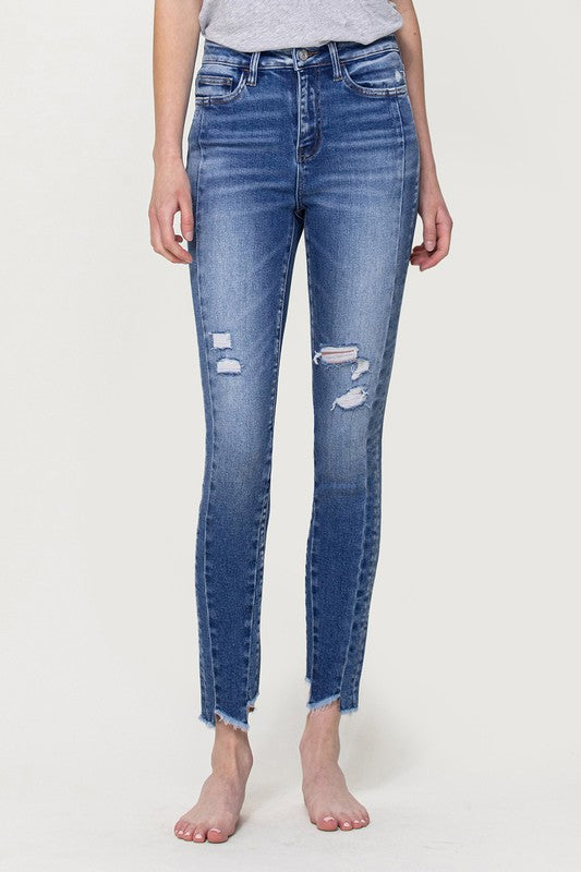 HIGH RISE ANKLE SKINNY W UNEVEN HEM DETAIL