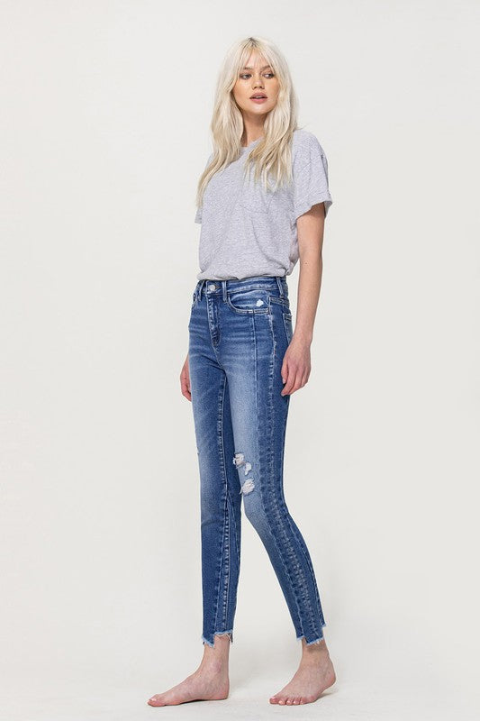 HIGH RISE ANKLE SKINNY W UNEVEN HEM DETAIL